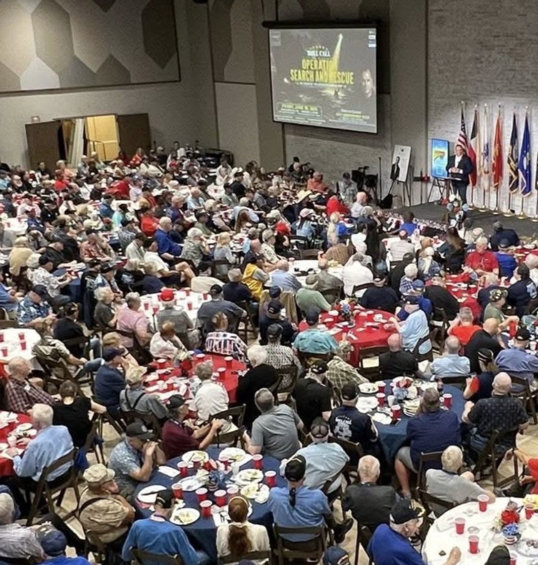 Eric Rush speaking to a packed room of 500-plus warfighters at Roll Call North Texas